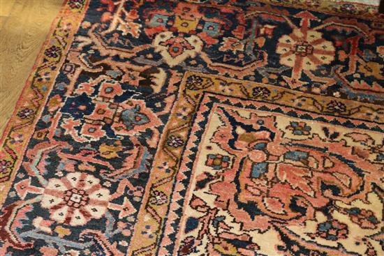 A Persian red ground carpet with pole medallion 372 x 255cm